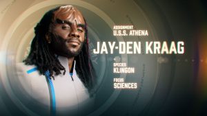Ritratto di Jay-Den Kraag, un Klingon in uniforme di Starfleet Academy, con dettagli sulle sue caratteristiche: Assegnazione USS Athena, Specie Klingon, Focus Scienze.